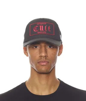 CULT OLD ENGLISH LOGO MESH BACK TRUCKER CURVED VISOR IN BLACK